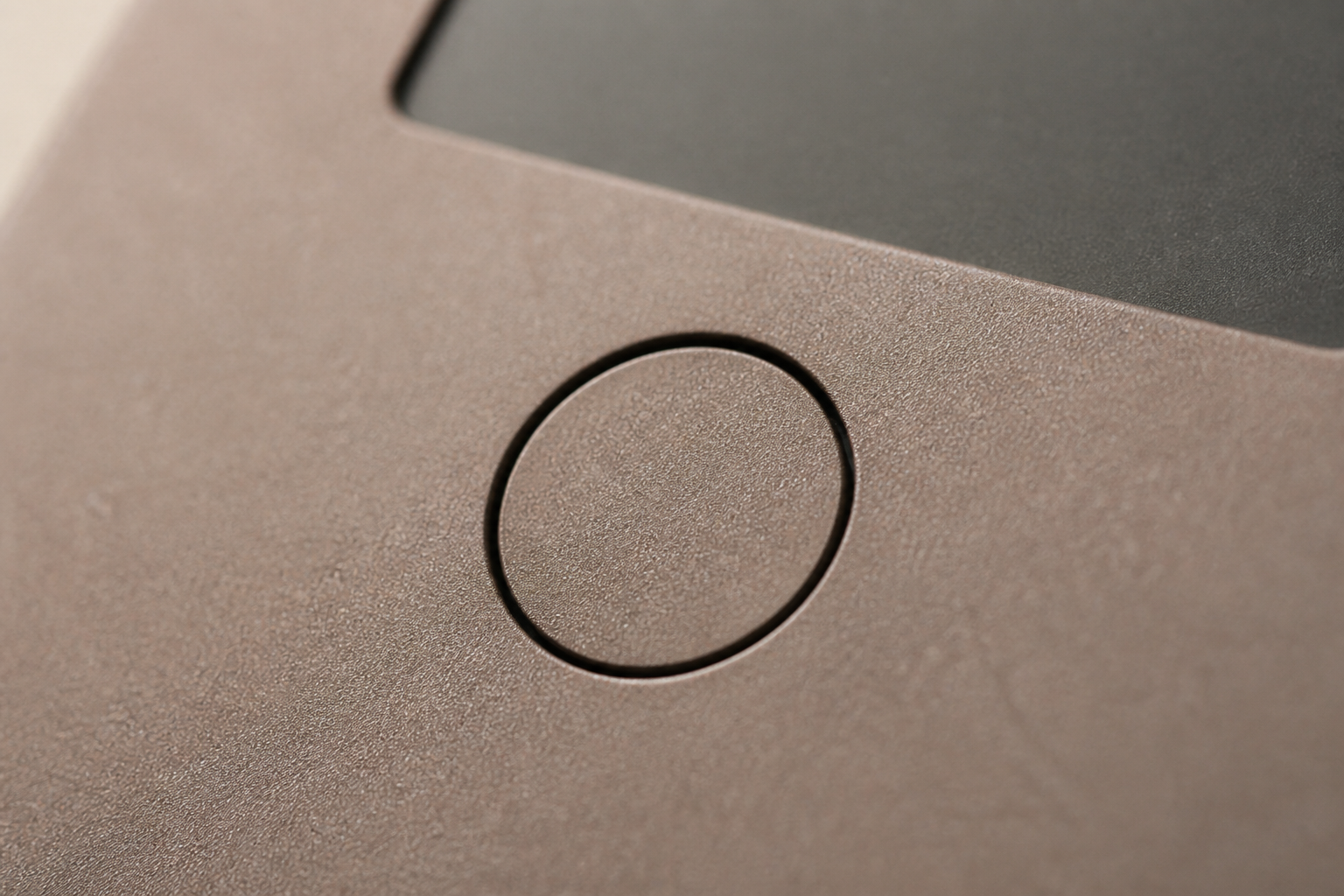 Macro of the circular home button and matte e-ink panel