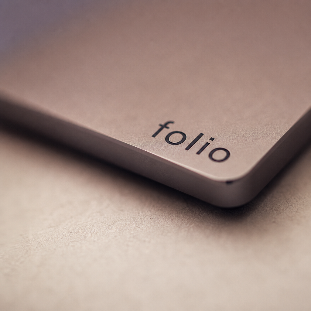 Embossed folio wordmark on chamfered aluminium